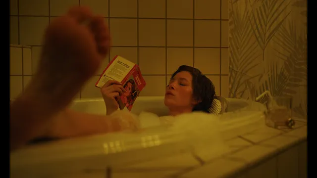 Jessica Biel a bathtub scene with a close view of a raised sole.