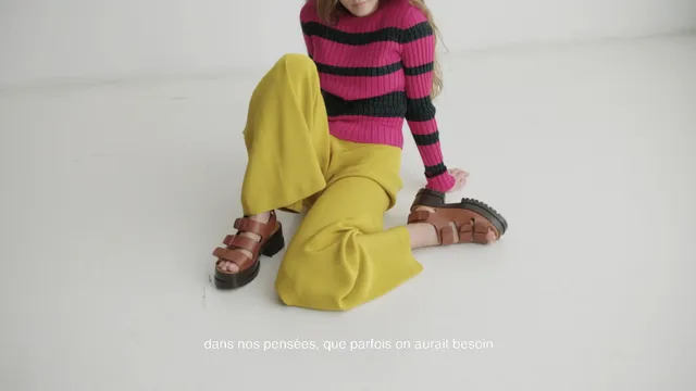 Havana Rose Liu posing in yellow trousers and platform sandals.