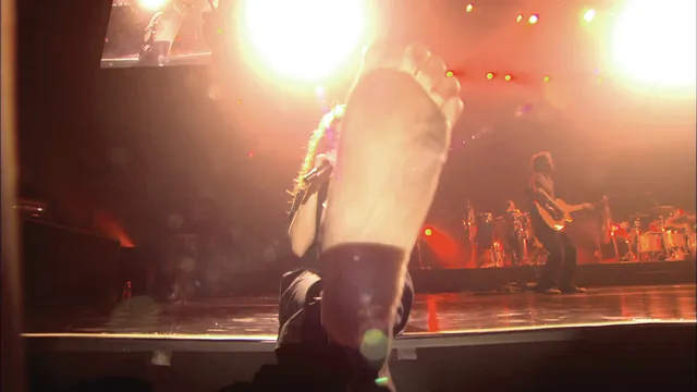 Shakira a close view of a sparkling stage heel.