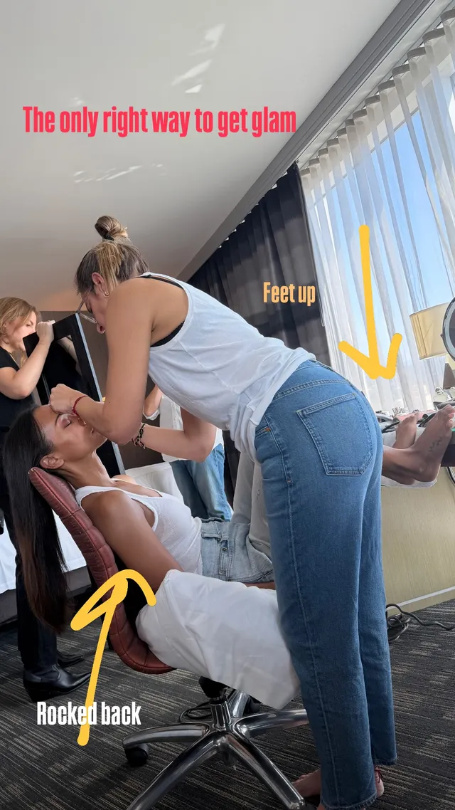 Zoe Saldaña reclining in a chair during makeup preparation.
