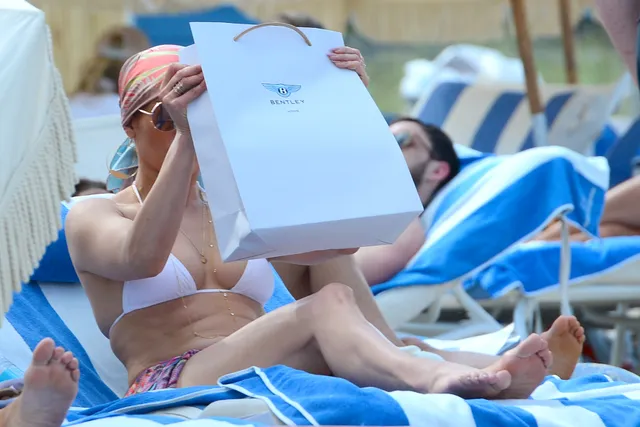 Jennifer Lopez a relaxed photograph on a blue sunbed.