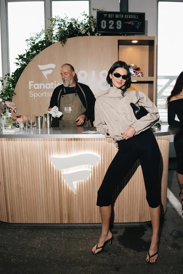Kendall Jenner wearing black heels with cropped trousers.