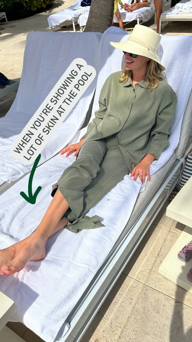 Kate Upton relaxing barefoot on a white outdoor lounger.