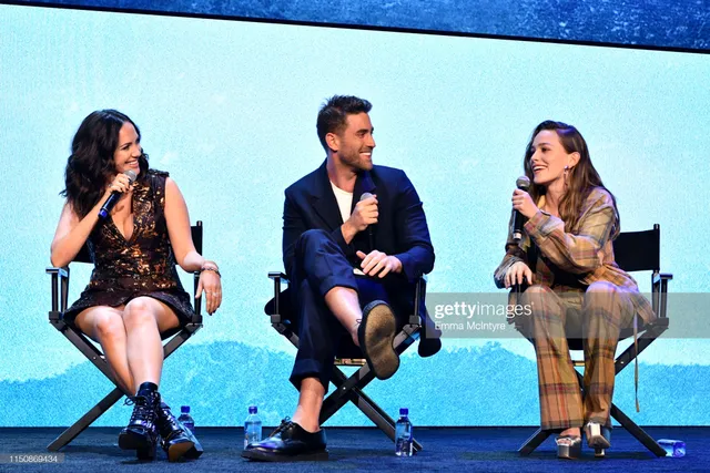 Victoria Pedretti sitting onstage during a panel discussion.