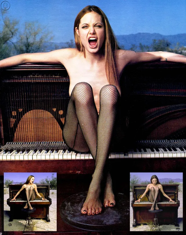 Angelina Jolie a piano portrait in sheer tights beside heels.