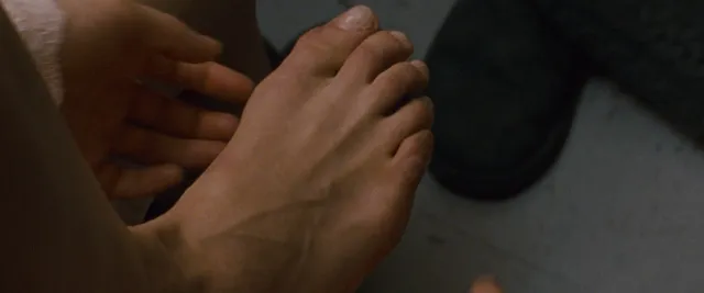 Natalie Portman resting a bare foot in a close-up screen scene.