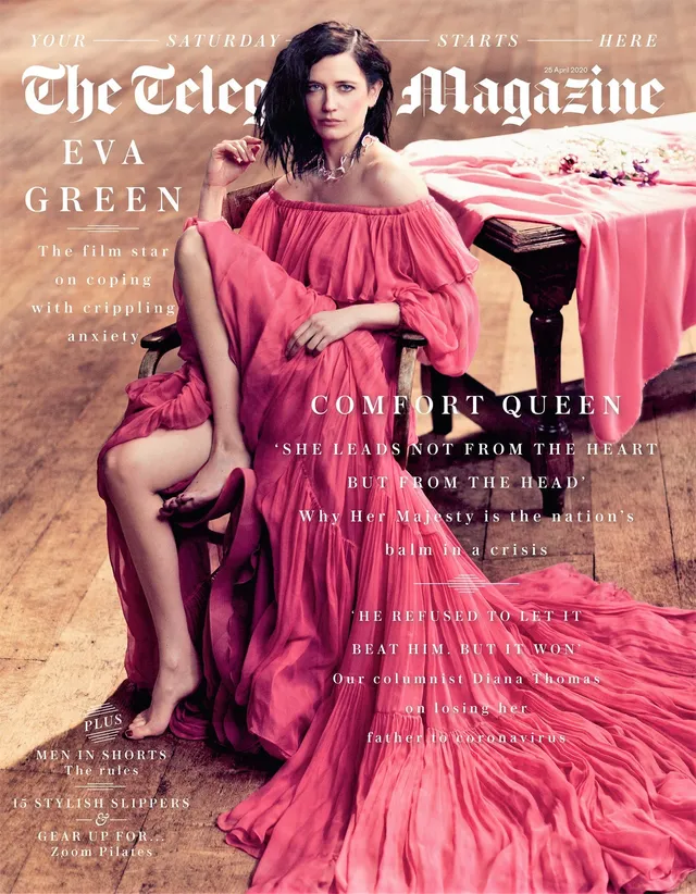 Eva Green a magazine cover portrait seated in a pink dress.