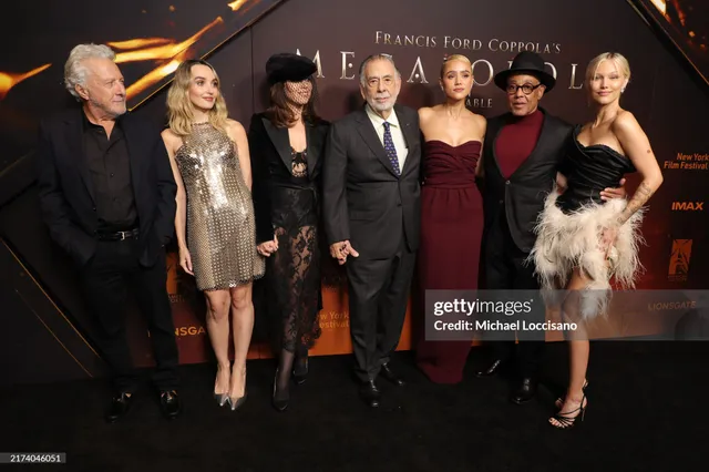 Grace VanderWaal posing with cast members at a film premiere in a feathered dress.
