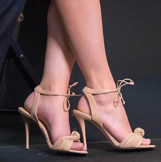 Elizabeth Gillies a close-up of pink lace-up heels.