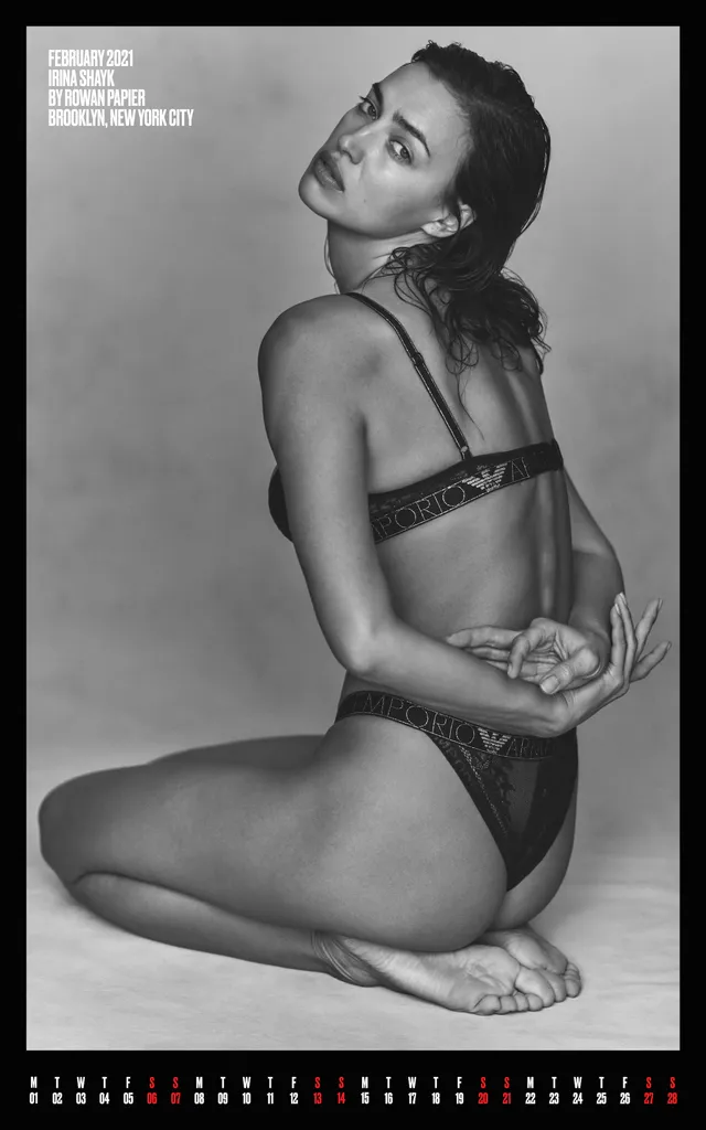 Irina Shayk a seated monochrome swimsuit portrait.