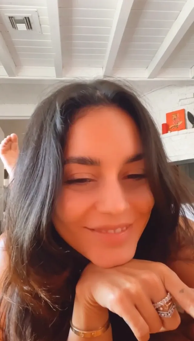 Vanessa Hudgens smiling for a close up indoor portrait.