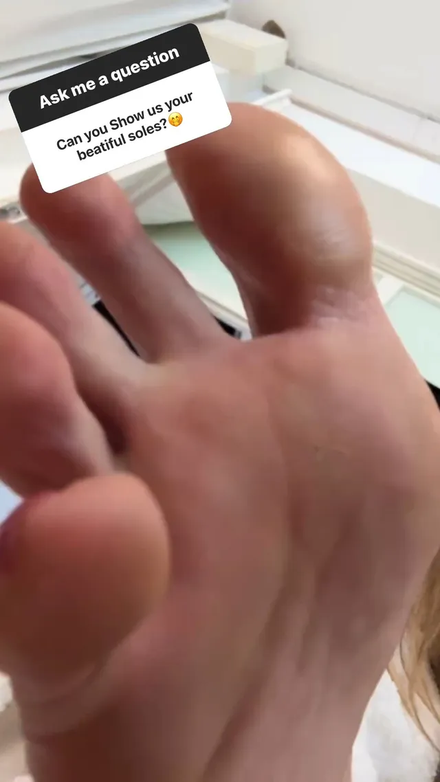 Heidi Klum showing her bare sole in a close-up photograph.