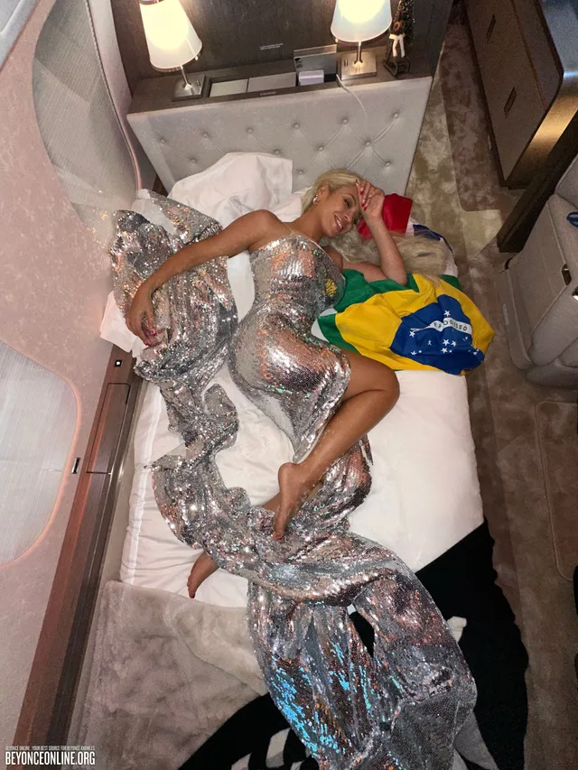 Beyoncé reclining in a metallic costume in an overhead photograph.