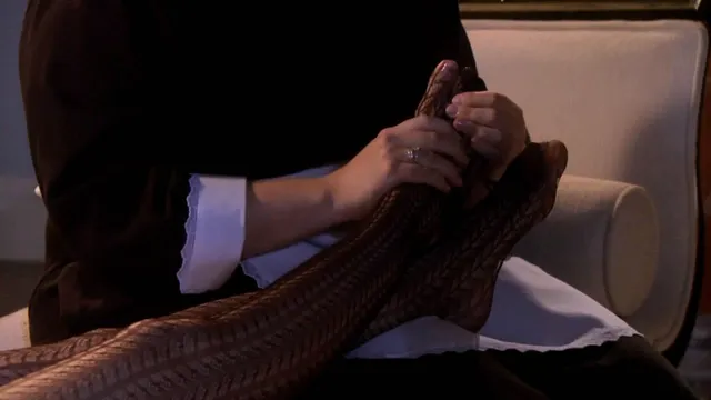 Leighton Meester resting her feet during a screen scene.