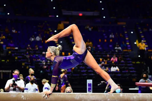 Olivia Dunne performing a floor routine at a gymnastics competition.