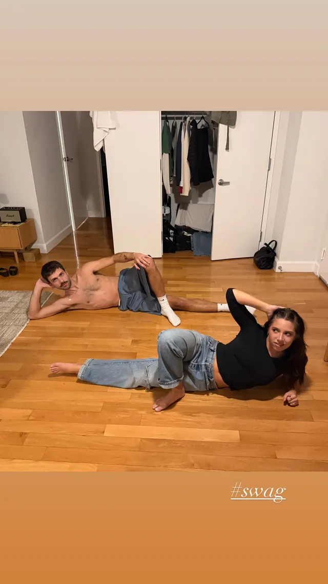 Mackenzie Ziegler exercising barefoot on a wooden floor beside another person.