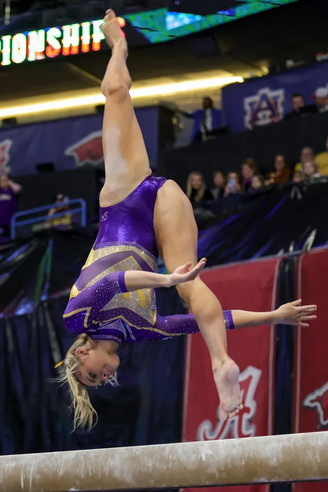 Olivia Dunne: performing barefoot on uneven bars.