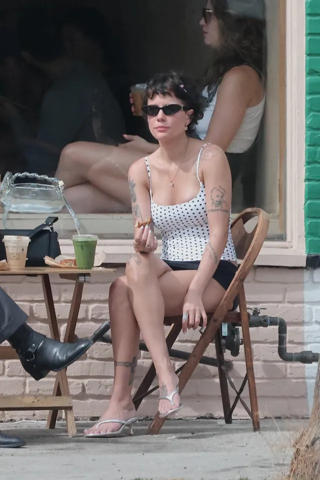 Halsey a seated casual portrait outdoors.