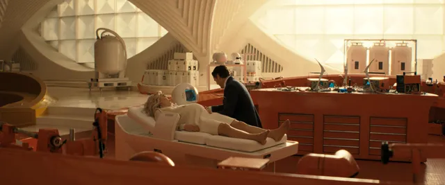 Vanessa Kirby a reclining screen scene in a bright room.