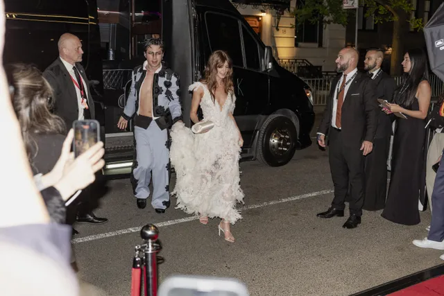 Daisy Edgar-Jones arriving at an event in a white textured dress.