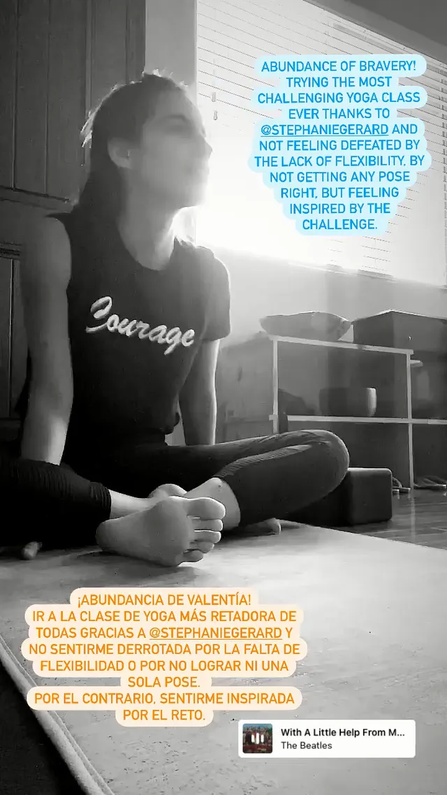 María Gabriela de Faría sitting barefoot on an exercise mat in a monochrome photograph.