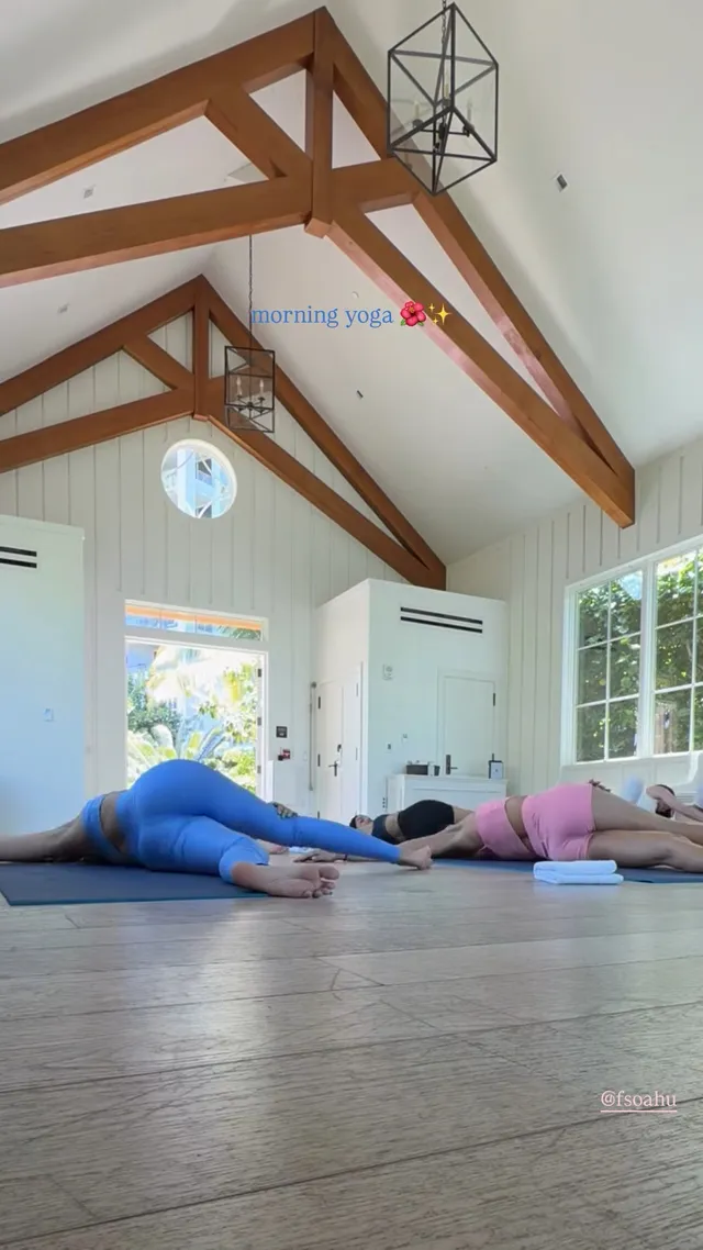 Victoria Justice lying on an exercise mat in a bright room.