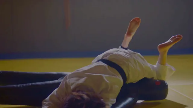Bae Suzy raising her bare feet in a scene.