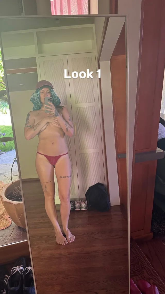 Tove Lo posing barefoot for a mirror photograph.