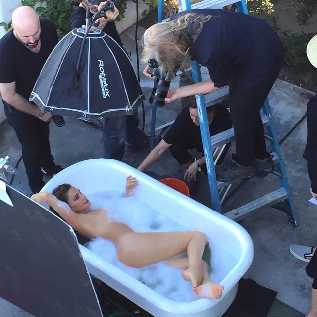 Sofía Vergara reclining in a bathtub during a photo shoot with her bare feet visible.