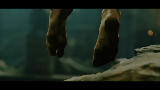 Charlize Theron a screen close detail of bare soles.