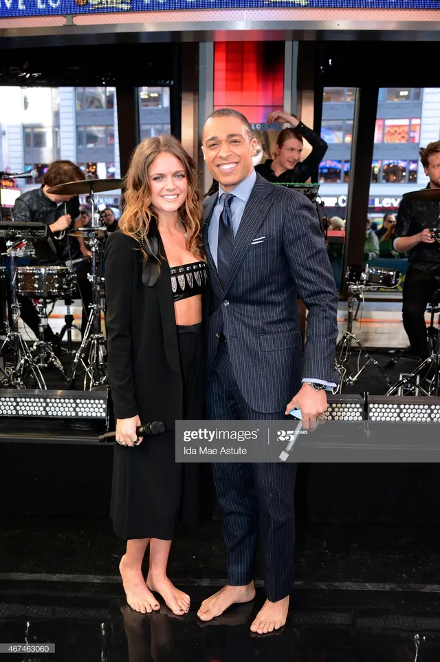 Tove Lo standing barefoot beside another person during a television appearance.
