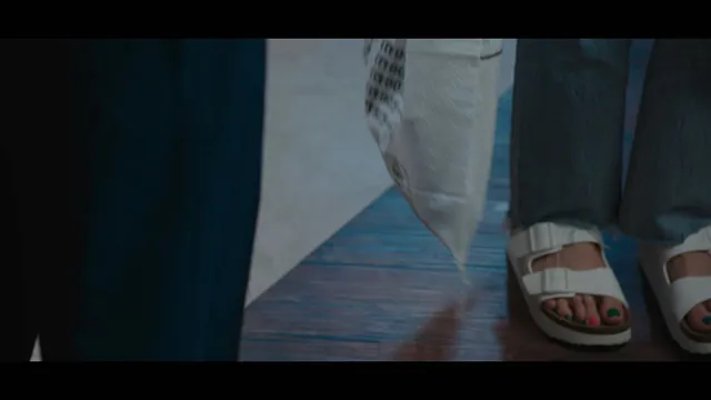 Bae Suzy wearing white platform slides in a scene.