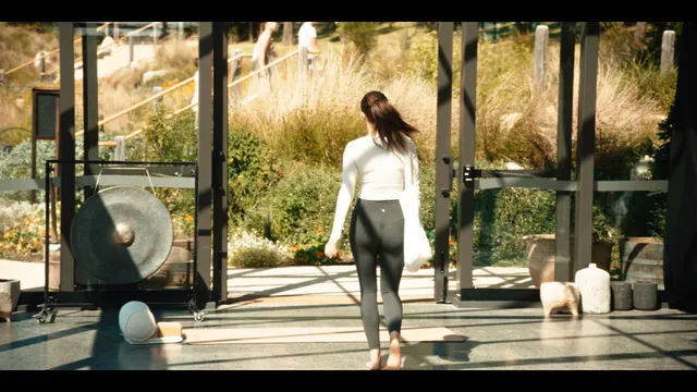 Alycia Debnam-Carey walking indoors during a screen scene.