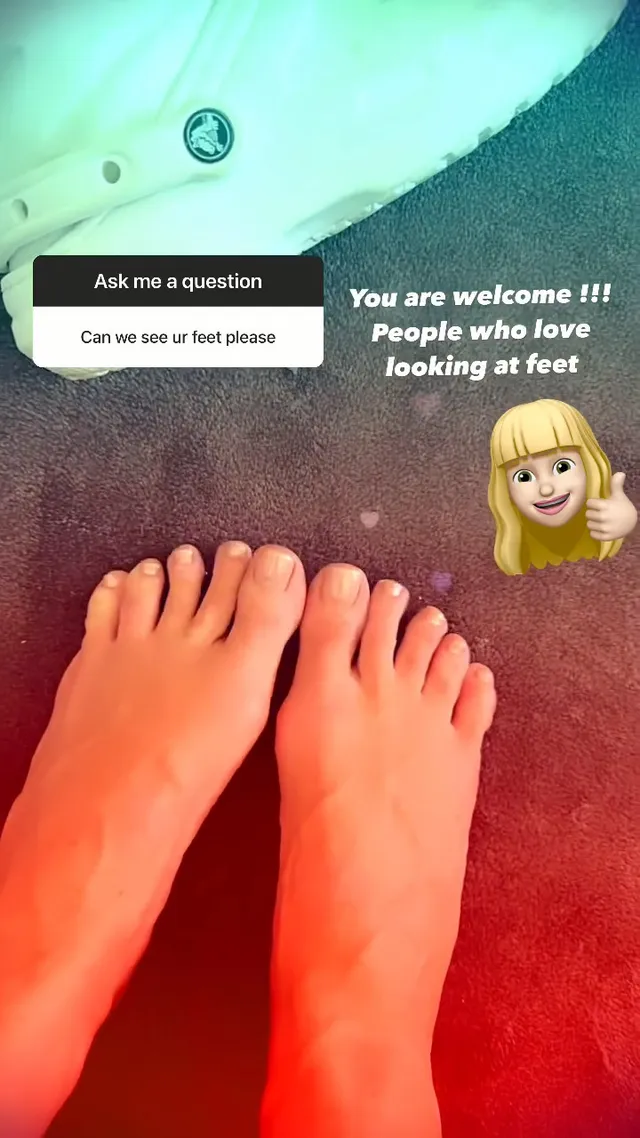 Heidi Klum showing her bare feet indoors.
