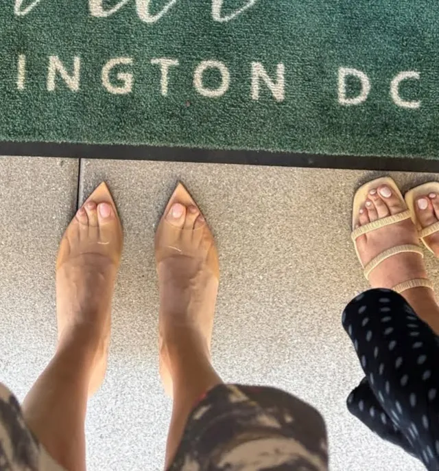 Eugenie Bouchard showing pale heeled sandals beside a companion’s sandals.
