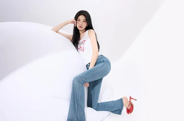 Bae Suzy posing in jeans and red heels.