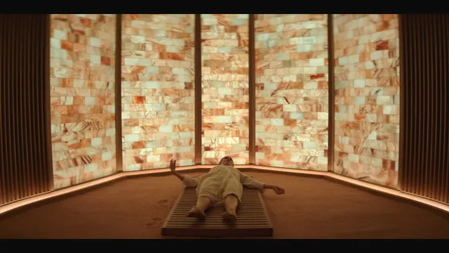 Jennifer Garner reclining indoors during a screen scene.