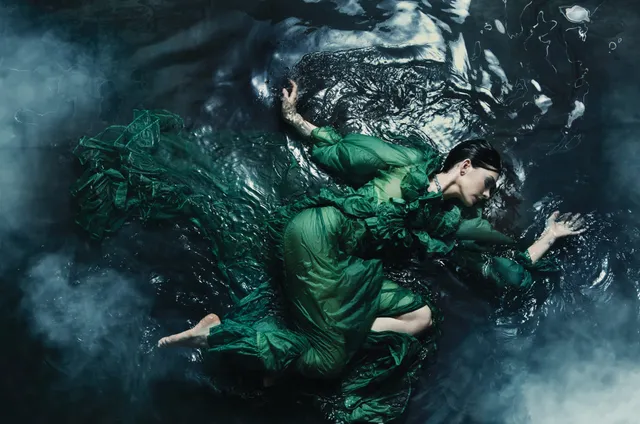 Anne Hathaway appearing in a scene surrounded by water.