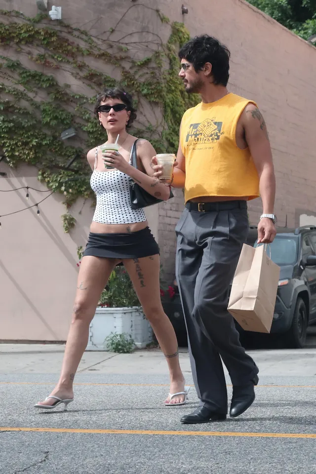 Halsey a casual outfit and flip-flops outdoors.