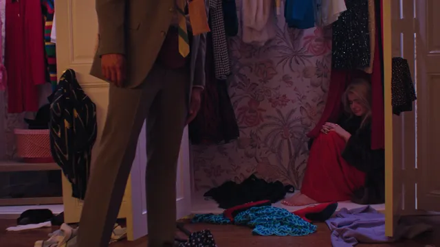 Ariel Winter resting on a bed during a screen scene.