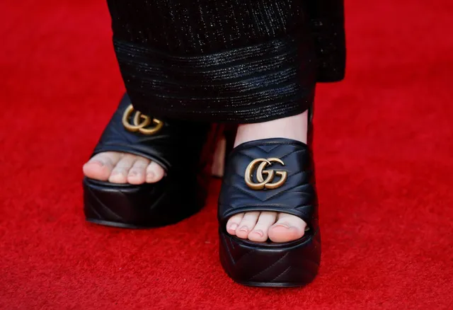 Billie Eilish black platform heels on red carpet.