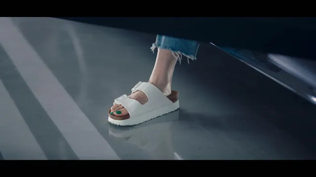 Bae Suzy walking in white platform slides.