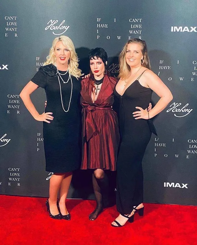 Halsey a burgundy dress and heels at a premiere.