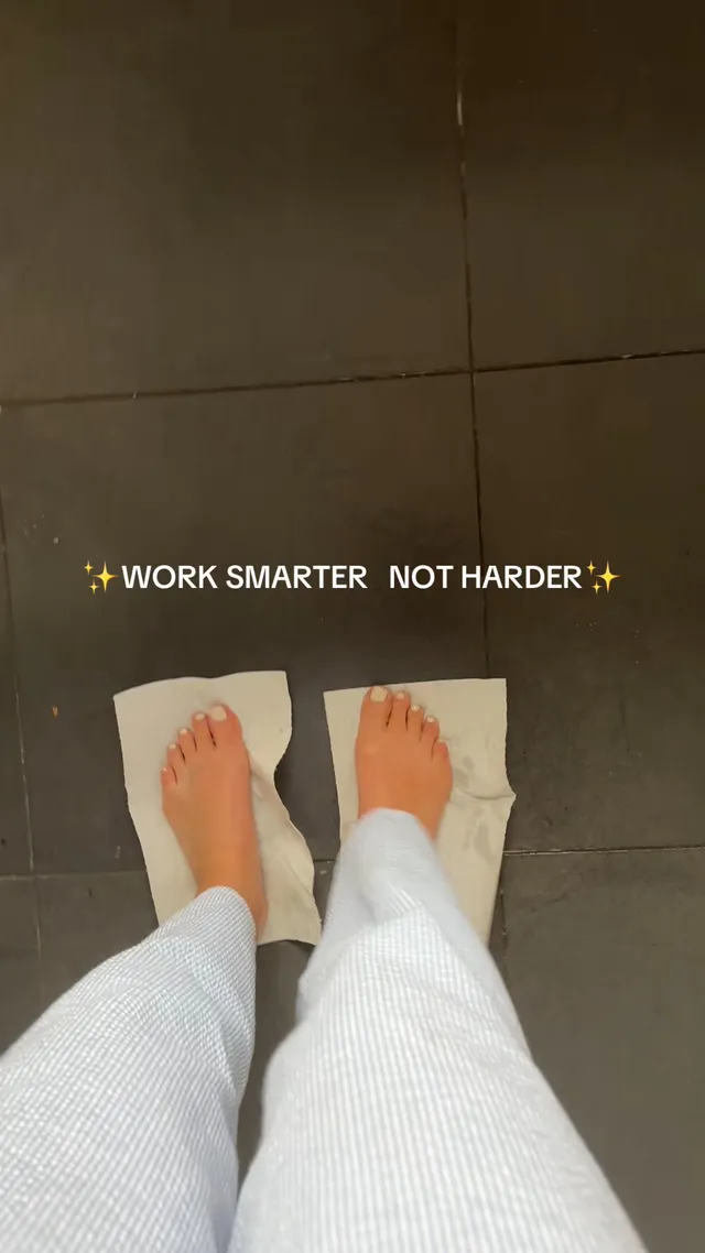 Sophie Nélisse standing with bare feet on paper towels indoors.