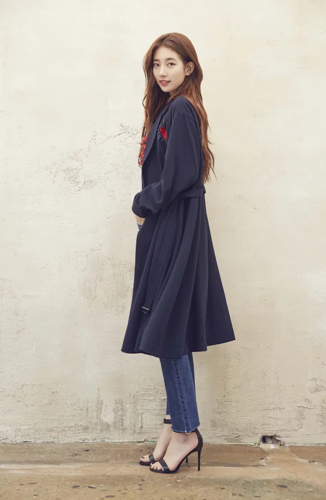 Bae Suzy wearing a navy coat and black heels.