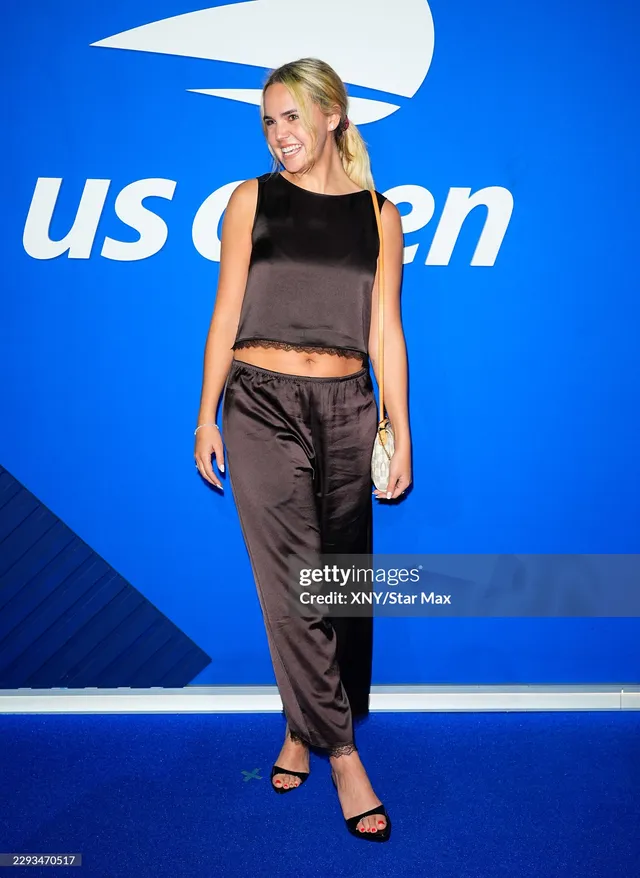 Bailee Madison wearing black heels at the US Open.