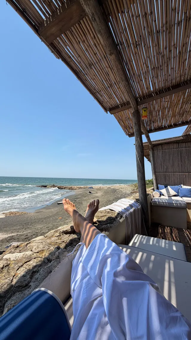 Irina Shayk relaxing under a beach cabana.