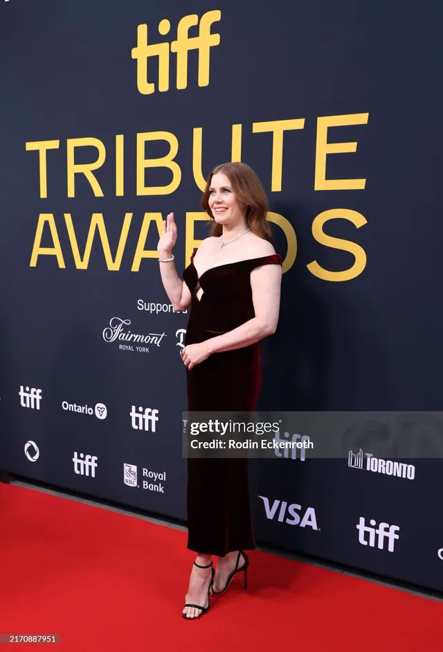 Amy Adams posing at a film festival awards event.