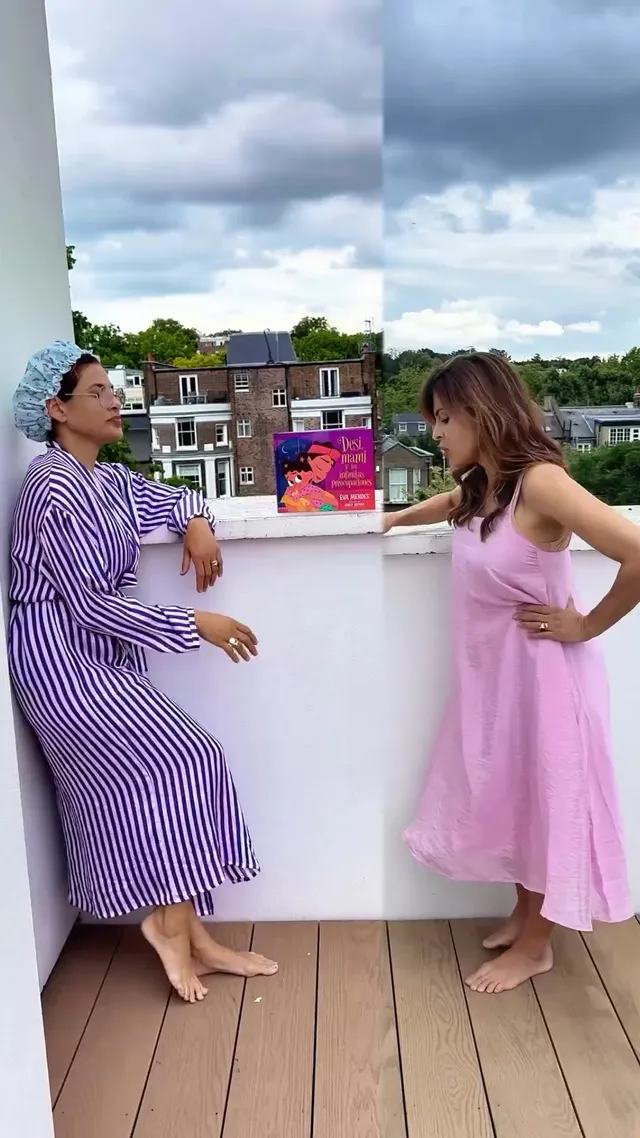 Eva Mendes standing with another woman beside an outdoor counter.