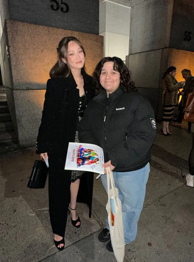 Havana Rose Liu posing with a companion in black heels.